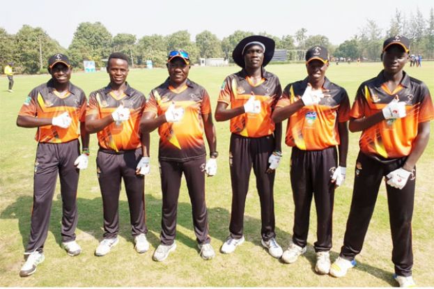 Mission India. Coach Steve Tikolo (3rd L) alongside the Future Cricket Cranes John Gabula (L), Derrick Bakunzi (2nd L), Juma Miyagi (R), Trevor Bukenya (2nd R) and Rogers Olipa donning the Omtex jersey and fielding gloves. COURTESY PHOTO