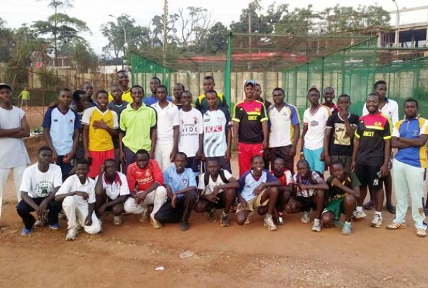 Generation Next founders Musali (2nd R) anf Karashani (C shades) pose with the academy kids at Lugogo nets. PHOTO BY JB SSENKUBUGE 