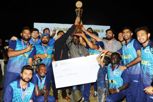 Keshwala Boyz receiving their trophy from UCA chairman Ansasiira (C) on Saturday night. PHOTO BY EDDIE CHICCO 