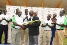 CEO Justine Ligyalingi hands over a bat and ball to new Cricket Cranes coach Tikolo (3rd L). Kamya (L), Ndiko (2nd L), Ogwang (4th L), Isaneez (4th R), Tumusiime (3rd R), Mugalula (2nd R) and Okecho (R) are the other coaches appointed by Uganda Cricket Association. Inset is Tikolo making a point during yesterday’s press conference in Lugogo. PHOTO BY EDDIE CHICCO 
