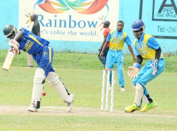 Runs Galore. Busoga College Mwiri’s star batsman Ronald Opio (L) piles on the runs against Rwanda Select XI. PHOTO BY EDDIE CHICCO 