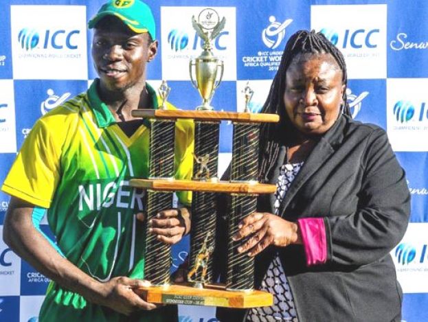 West Africa Pride. Patricia Kambarami (R), the ICC Development Manager for Africa, hands over the winners trophy to Nigeria captain Sylvester Ameh Okpe on Tuesday in Potchefstroom. PHOTO: ICC MEDIA 