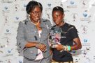 An elated Nakisuyi picks her award from Speaker of Parliament Kadaga (L) on Thursday night . PHOTO BY EDDIE CHICCO 