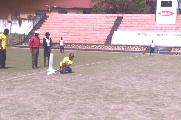 A visually impaired girl from Salaama Secondary School swings hard at a delivery at Lugogo Hockey’s astro turf pitch yesterday. photo by DARREN ALLAN KYEYUNE 