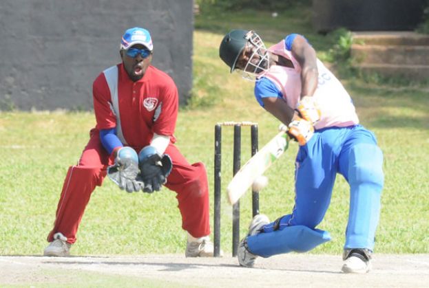 Lubega hits out in his match-winning knock of 35 at Lugogo Oval yesterday. Keeping wickets for Tornado is veteran Davis Turinawe. photo by EDDIE CHICCO 
