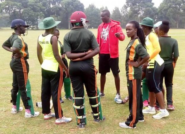 The Tornado Bee Coach ;Ogwang Jackson talking to his players during their match against Charity CC at Entebbe Oval