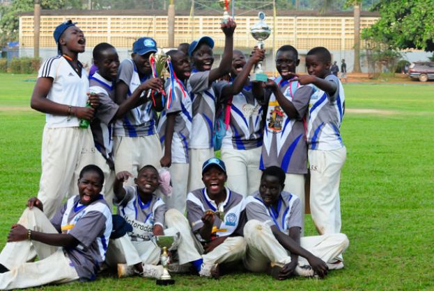 Jinja SS celebrate their third consecutive national title soon after toppling Kololo SS by seven wickets in the final. On the right from the top is new head coach Turinawe, women’s coach Nsubuga and development manager Okecho. PHOTO BY EDDIE CHICCO 