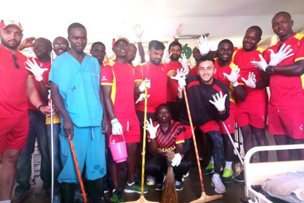 Giving hope. Team Uganda mopped the verandah of the 1945 establishment, swept the compound and wrapped it up by putting smiles on their hosts’ faces as they handed over an assortment of play toys. PHOTO BY EDDIE CHICCO  