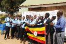 Ntono (C) after receiving the flag from NCS’s Katende yesterday. PHOTO BY EDDIE CHICCO 