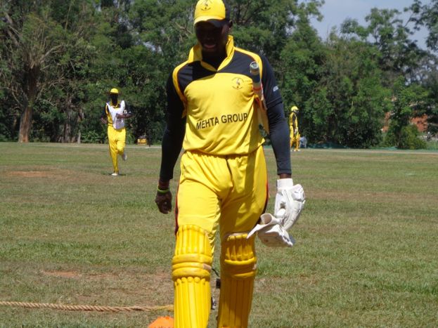 Mukasa Leaving the pitch after the fall of his wicket
