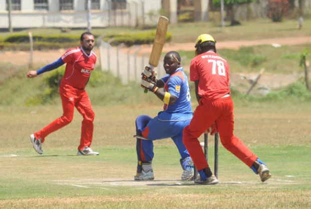 Nile tail-ender Ivan Kakande is bowled neck and crop by KICC leg-spinning wizard Irfan Afridi (L) as he tried to muscle a big one to the leg-side in vain at Kyambogo Oval on Sunday. Abdallah Ssezooba (78) is the wicket-keeper. PHOTO BY EDDIE CHICCO 