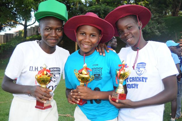 From Left: Esther Iloku, Mildred Anyigo, Joyce Mary Apio took the best wicketkeeper, batter and bowler awards respectively. Photo by Eddie Chicco 