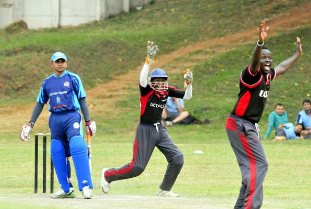 Charity wicket keeper Sharma Mukaaya Uzama (C) and medium pacer Simon Ayella (R) successfully appeal for an lbw dismissal against Kutchi Tigers on Sunday. photo: Eddie Chicco 